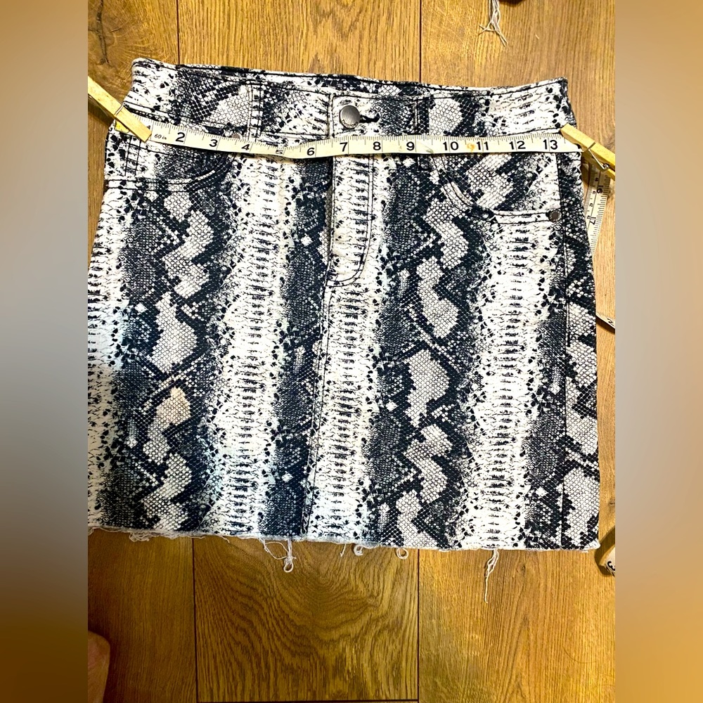 Free with any purchase!  Black and white snake print mini skirt junior sz 3
